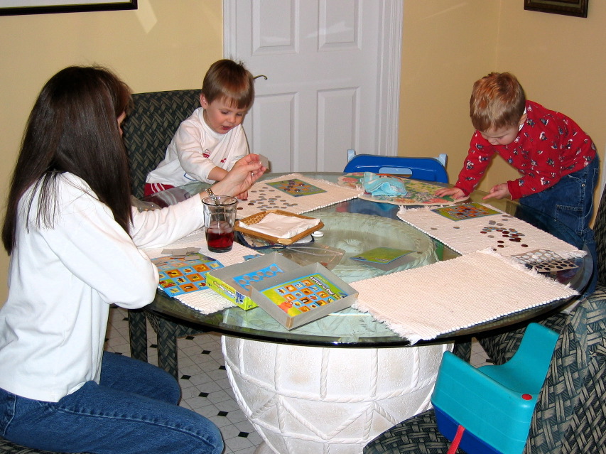 Mommy calls out letters for Elijah and me.