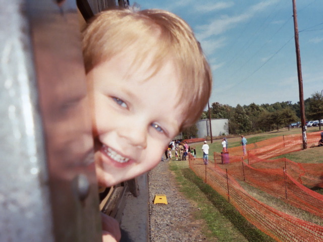 "Look at me... I'm riding on a train behind Thomas!"