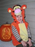 I'm sitting next to Dad's cool pumpkin carving!